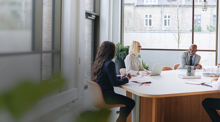 Women talking in an office.