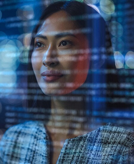 Image of a women looking at code