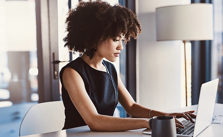 Shot of a young businesswoman working on a laptop in her office.