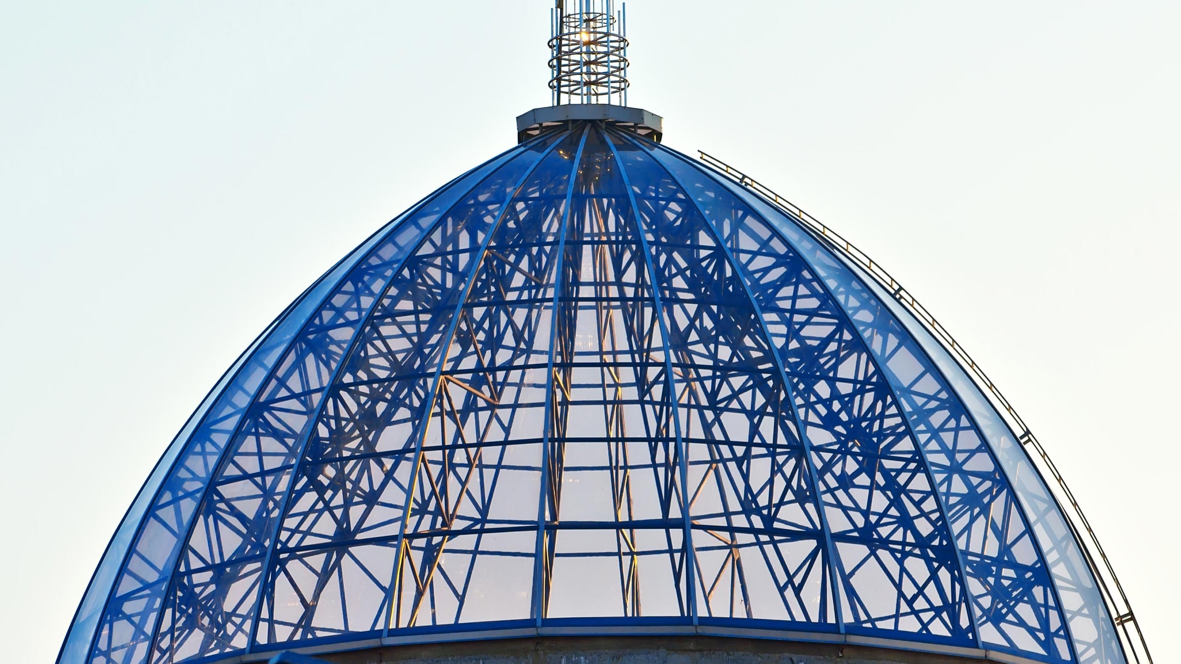 Glass dome on a background of blue sky