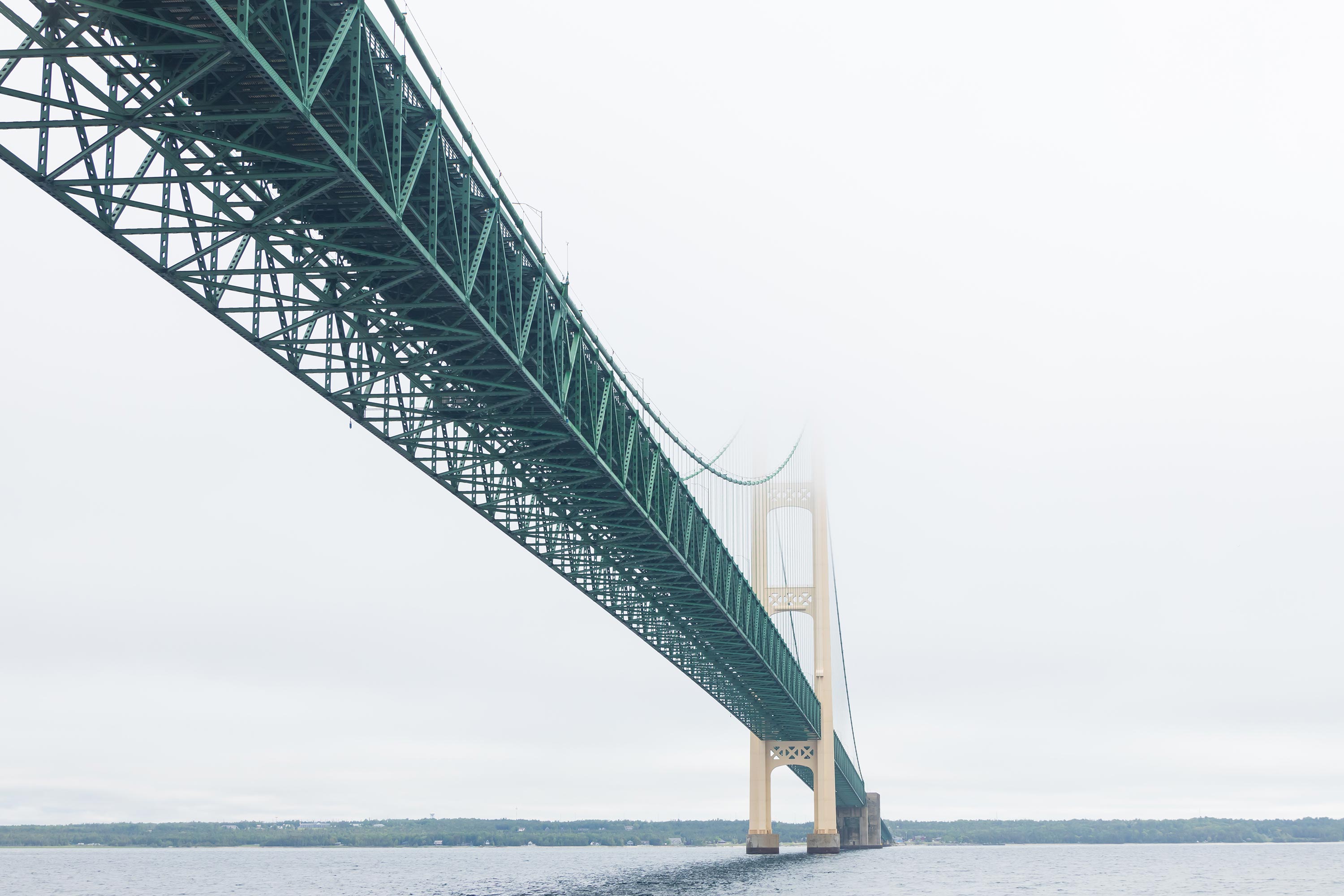 long bridge fades into distance in fog