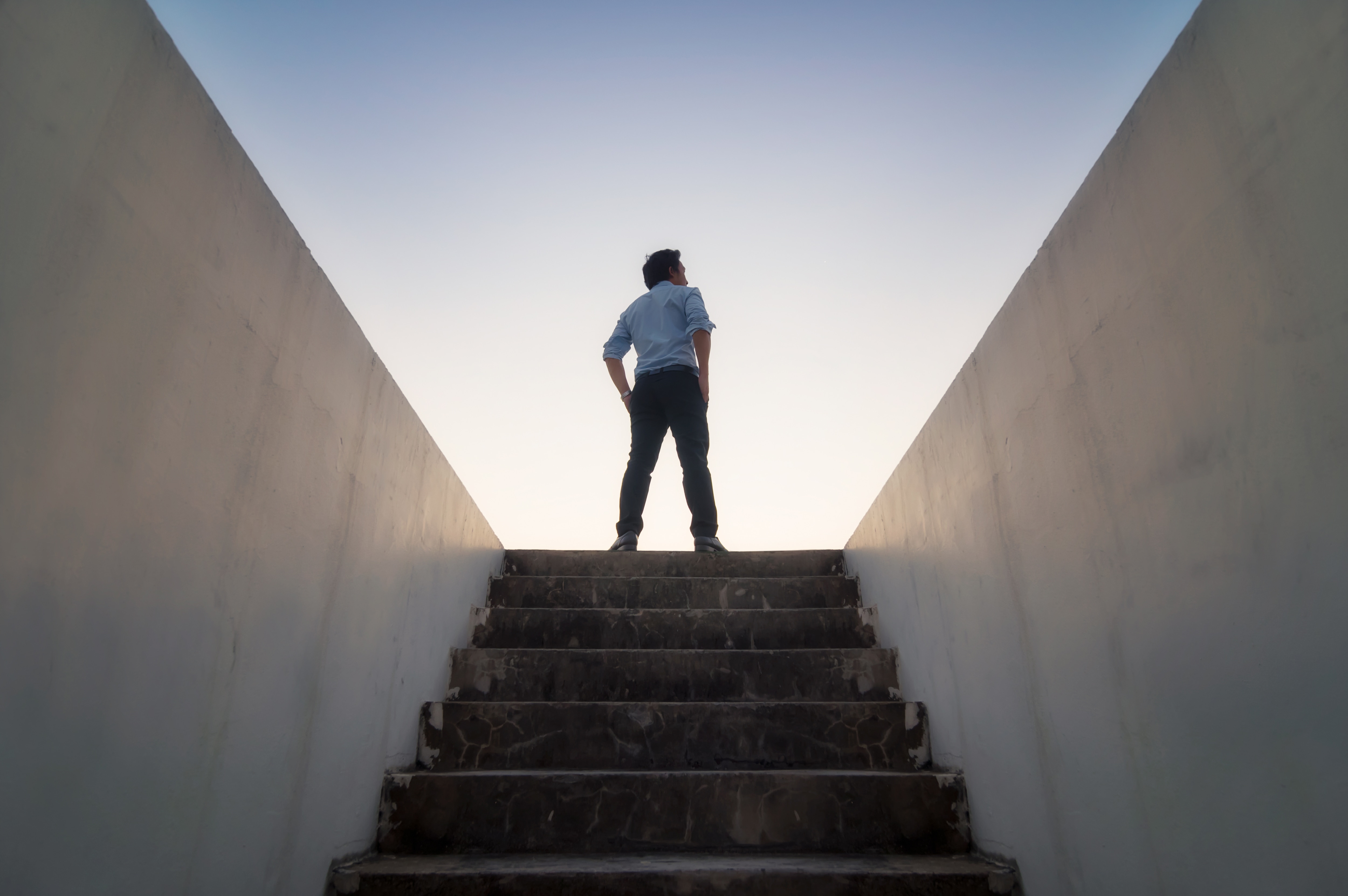 Man at top of stairs looking to the sky