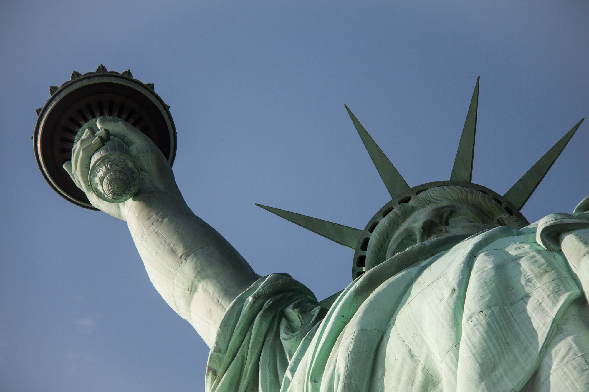 looking up at the statue of liberty