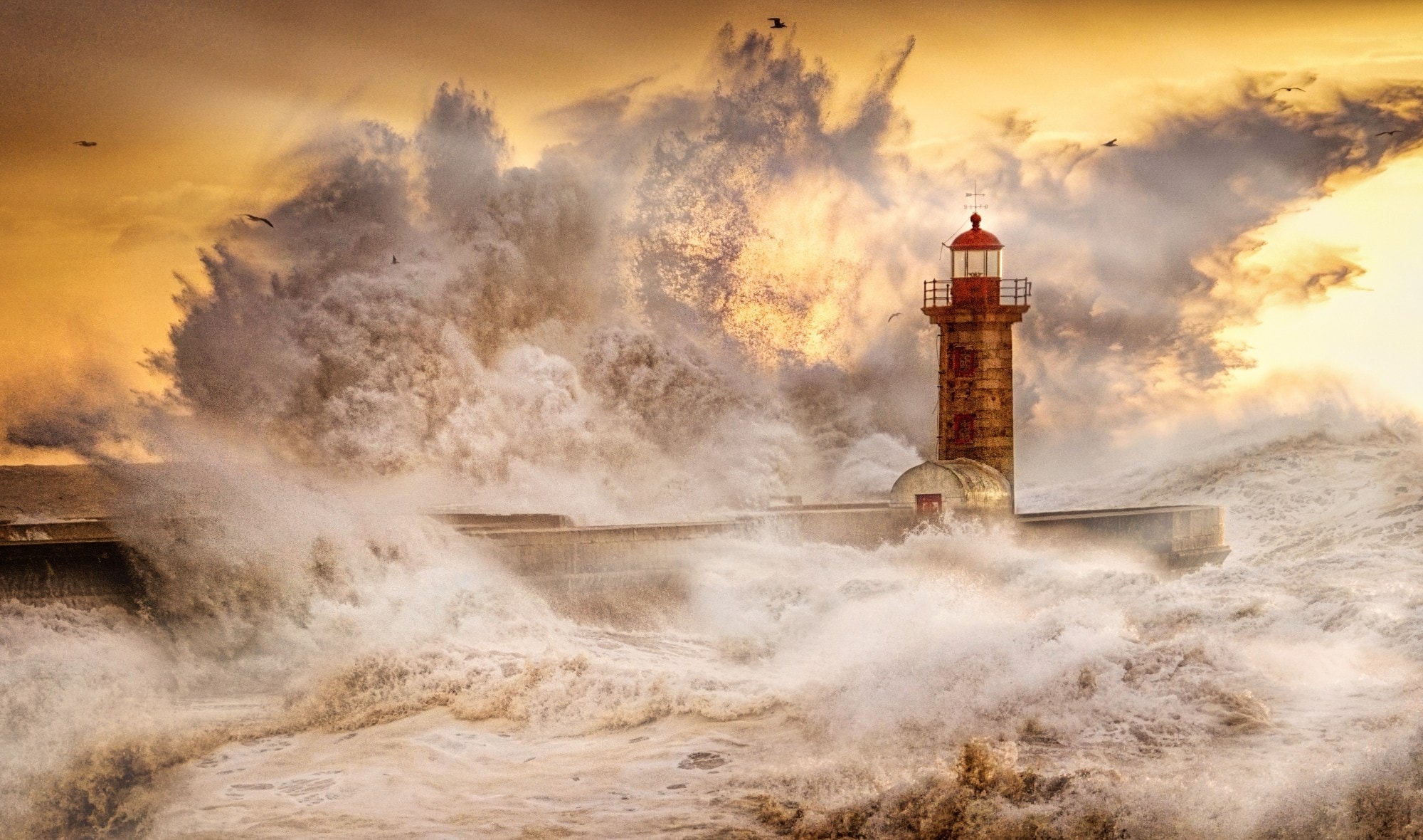 crashing waves over lighthouse