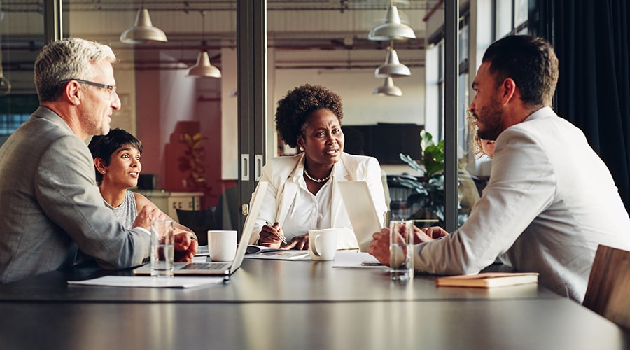 A group of people meeting a financial advisor