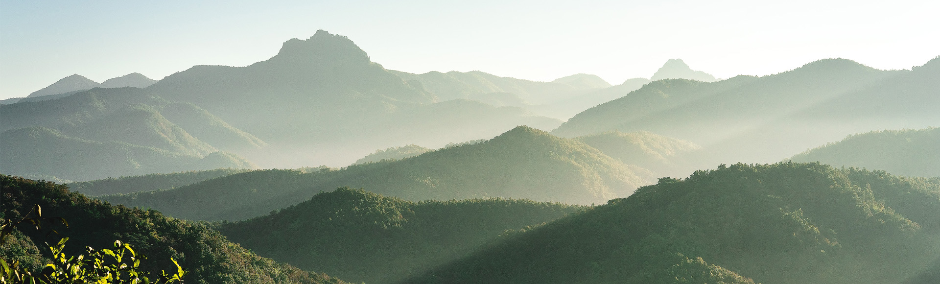 fog rolls in over mountain tops