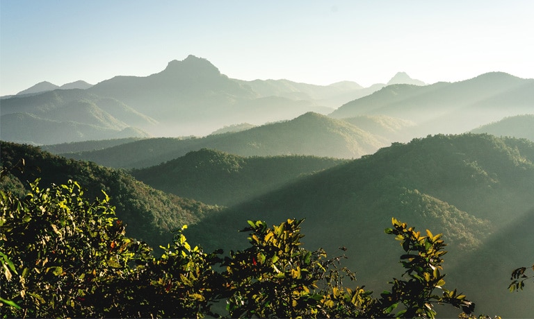 fog rolls in over mountain tops
