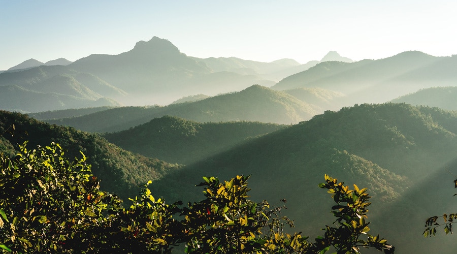 fog rolls in over mountain tops