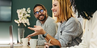 Younger employees meeting together in a conference room.