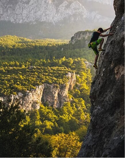 Rock climber scaling a cliff.
